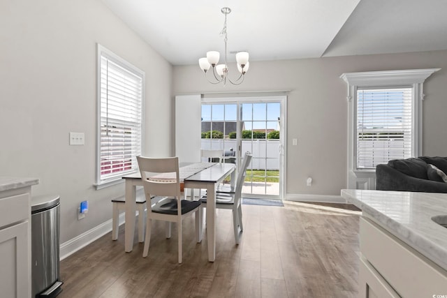712 Hobonny Loop, Longs, SC 29568 - dining area featuring baseboards, a notable chandelier, and wood finished floors
