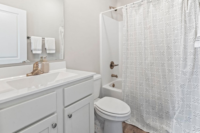 bathroom featuring vanity, shower / bathtub combination with curtain, and toilet