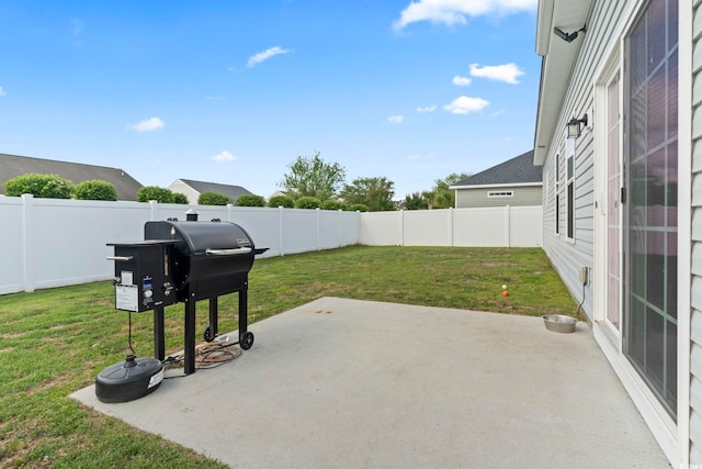 view of patio with a fenced backyard and a grill