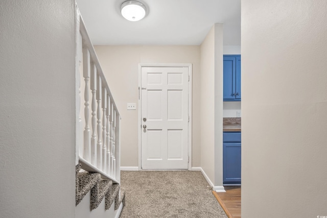 2701 Hillside Dr S Unit 1, North Myrtle Beach, SC 29582 - carpeted entrance foyer with stairs and baseboards