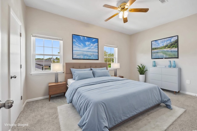 2701 Hillside Dr S Unit 1, North Myrtle Beach, SC 29582 - bedroom featuring light carpet, baseboards, and a ceiling fan