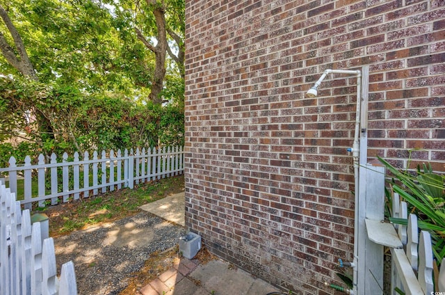 details with brick siding and fence