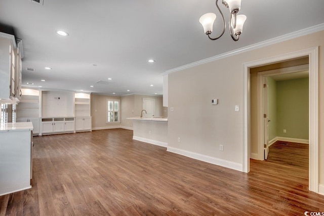 107 Azalea Dr, Conway, SC 29526 - unfurnished living room featuring crown molding, recessed lighting, baseboards, and wood finished floors