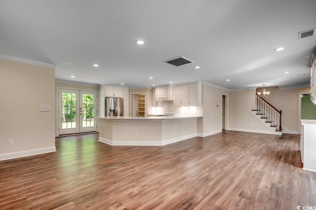 107 Azalea Dr, Conway, SC 29526 - unfurnished living room featuring recessed lighting, baseboards, wood finished floors, visible vents, and ornamental molding