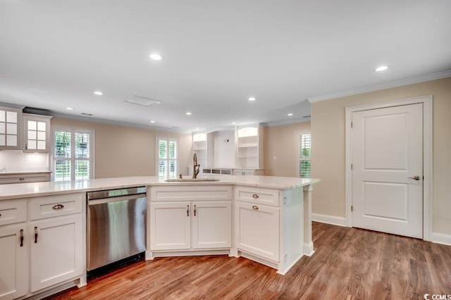107 Azalea Dr, Conway, SC 29526 - kitchen with crown molding, light wood-type flooring, white cabinets, a sink, and dishwasher