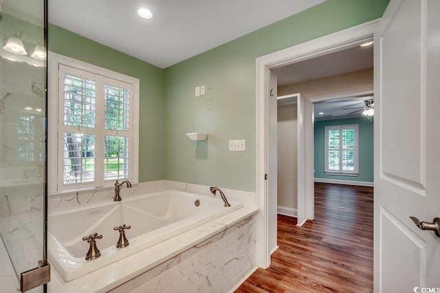 107 Azalea Dr, Conway, SC 29526 - bathroom with a garden tub, a ceiling fan, baseboards, and wood finished floors