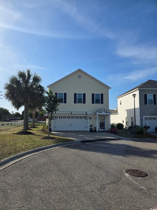 view of front of property with an attached garage and driveway