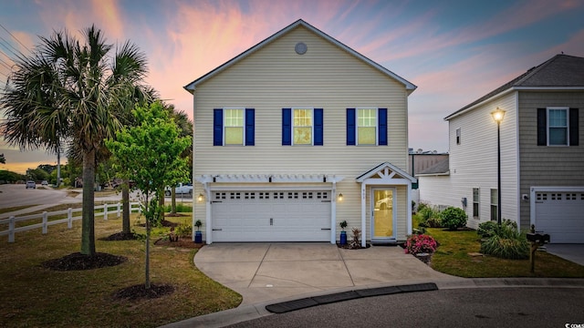 903 Ocean Pines Ct, North Myrtle Beach, SC 29582 - traditional-style house featuring an attached garage, concrete driveway, and fence