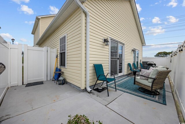 903 Ocean Pines Ct, North Myrtle Beach, SC 29582 - rear view of property featuring a patio area, a fenced backyard, and a gate