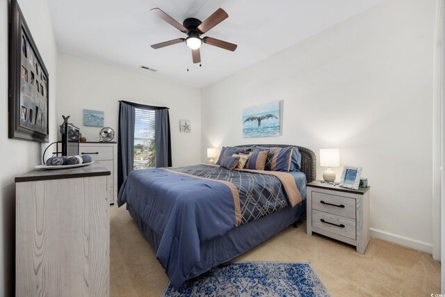 903 Ocean Pines Ct, North Myrtle Beach, SC 29582 - bedroom featuring light colored carpet, baseboards, and a ceiling fan