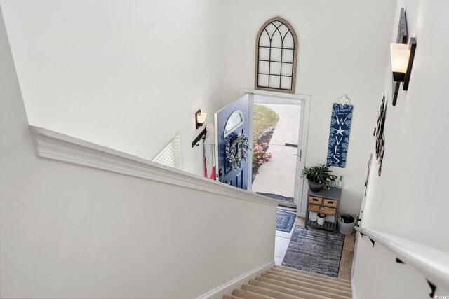 903 Ocean Pines Ct, North Myrtle Beach, SC 29582 - entryway with a high ceiling, stairway, and baseboards