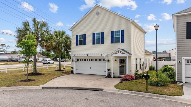903 Ocean Pines Ct, North Myrtle Beach, SC 29582 - traditional home featuring an attached garage, fence, and concrete driveway