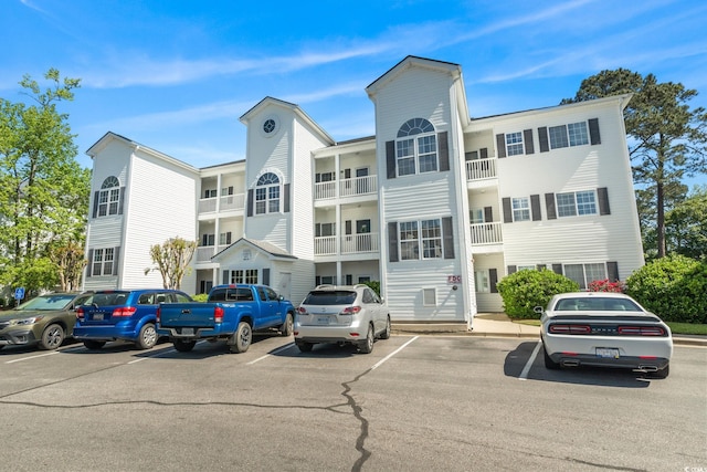 view of property featuring uncovered parking