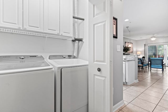 laundry area featuring cabinet space, independent washer and dryer, a ceiling fan, and light tile patterned flooring