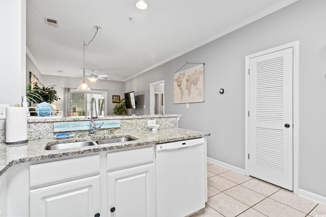 kitchen with white dishwasher, light stone countertops, light tile patterned floors, a sink, and white cabinetry