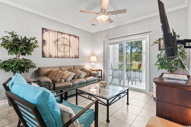 living area featuring a ceiling fan, visible vents, crown molding, light tile patterned floors, and baseboards