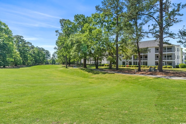 surrounding community featuring a lawn