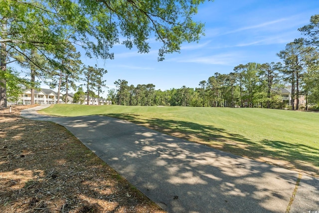 view of home's community featuring a lawn