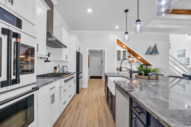1004 Whooping Crane Dr, Conway, SC 29526 - kitchen featuring white cabinets, a sink, stainless steel appliances, decorative backsplash, and ornamental molding