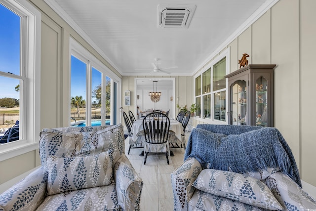 sunroom / solarium featuring crown molding and visible vents
