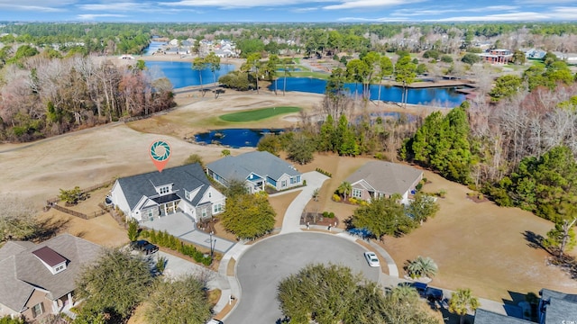 birds eye view of property featuring a water view and a residential view