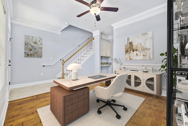 office with ceiling fan, ornamental molding, and light wood finished floors