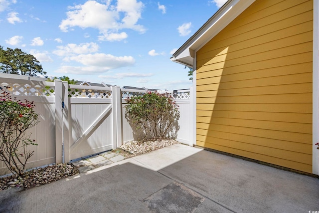 exterior space with a patio and fence