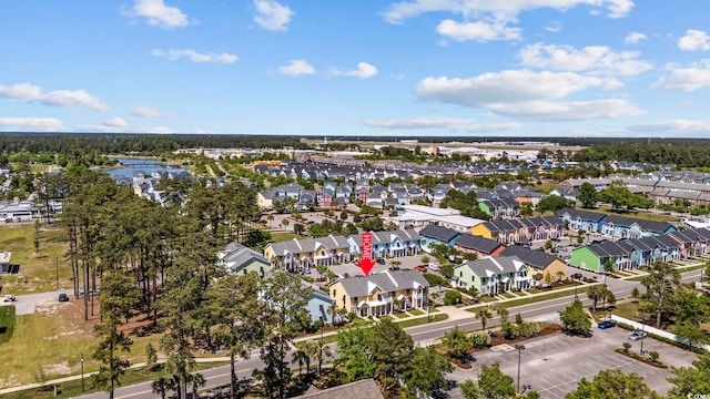 bird's eye view with a residential view and a water view