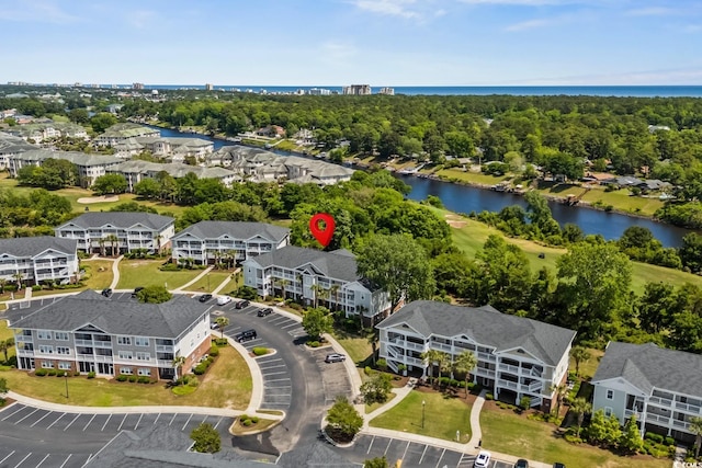 aerial view with a water view and a residential view