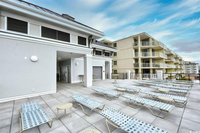 view of patio featuring fence