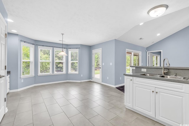 389 Barton Loop, Myrtle Beach, SC 29579 - kitchen featuring a sink, light tile patterned floors, white cabinets, recessed lighting, and vaulted ceiling