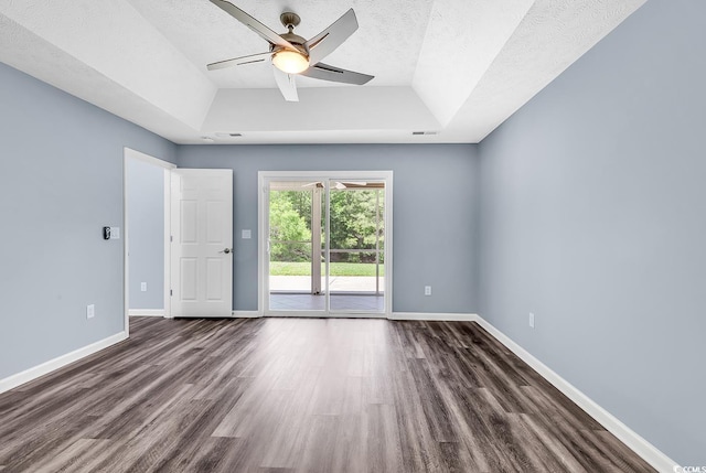 389 Barton Loop, Myrtle Beach, SC 29579 - empty room with dark wood-type flooring, a ceiling fan, baseboards, a textured ceiling, and vaulted ceiling