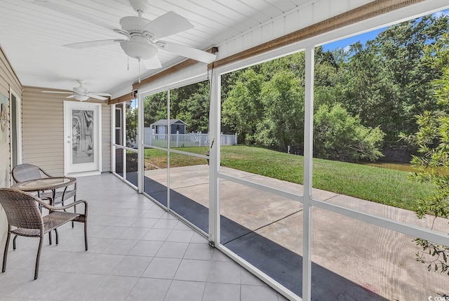 389 Barton Loop, Myrtle Beach, SC 29579 - sunroom featuring ceiling fan, plenty of natural light, and view of wooded area