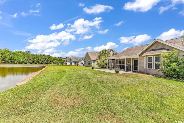389 Barton Loop, Myrtle Beach, SC 29579 - view of grassy yard featuring a sunroom and a water view