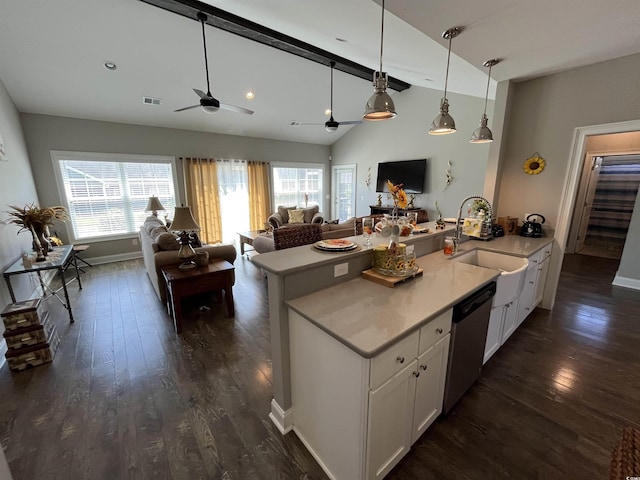 kitchen with a sink, ceiling fan, lofted ceiling with beams, and dark wood-style floors
