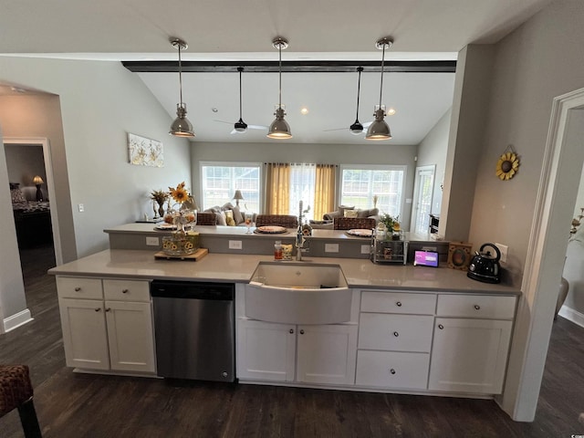 kitchen with stainless steel dishwasher, dark wood-style floors, a sink, and lofted ceiling