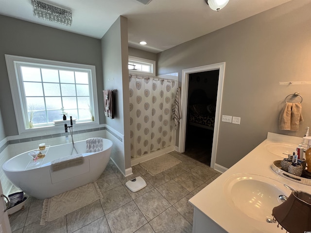 bathroom featuring a freestanding bath, a sink, tile patterned floors, curtained shower, and visible vents