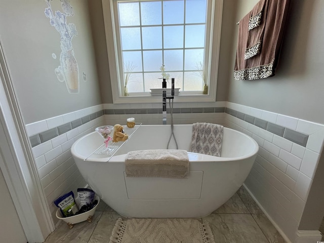 4008 Tupelo Ct, Conway, SC 29526 - full bathroom featuring wainscoting, a freestanding bath, and tile walls