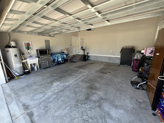 garage featuring a sink and water heater