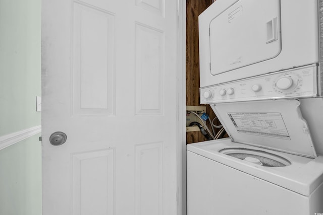 laundry room featuring stacked washer and clothes dryer