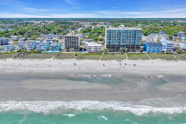 bird's eye view featuring a water view and a view of the beach