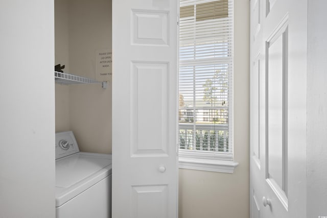 clothes washing area featuring laundry area and washer / dryer