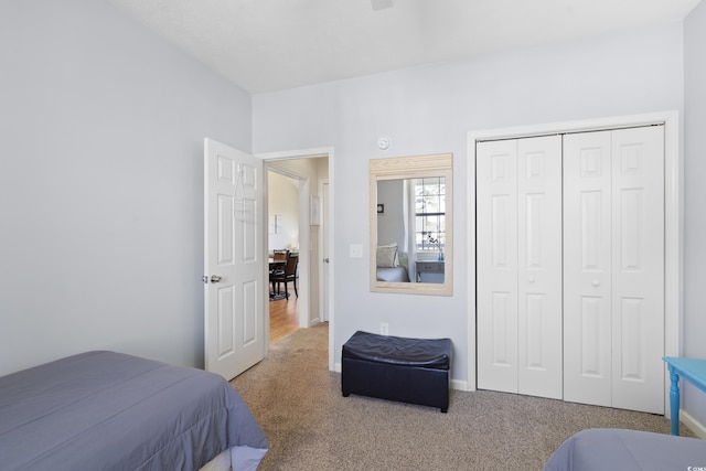 carpeted bedroom with a closet