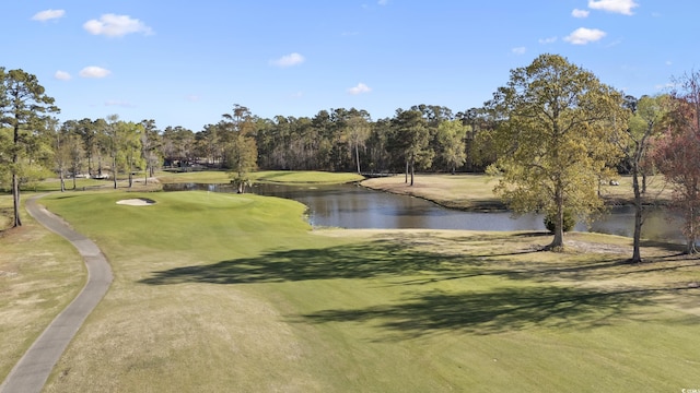 view of community with a water view and golf course view