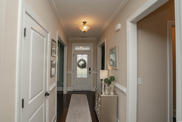 doorway with crown molding, baseboards, and dark wood-style floors