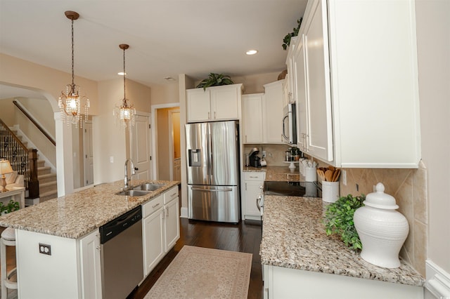 kitchen featuring white cabinets, stainless steel appliances, dark wood-style floors, and a sink