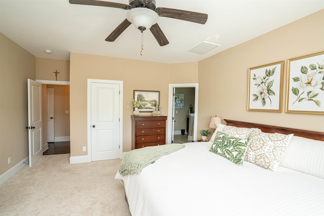 bedroom with light colored carpet, baseboards, ceiling fan, and visible vents