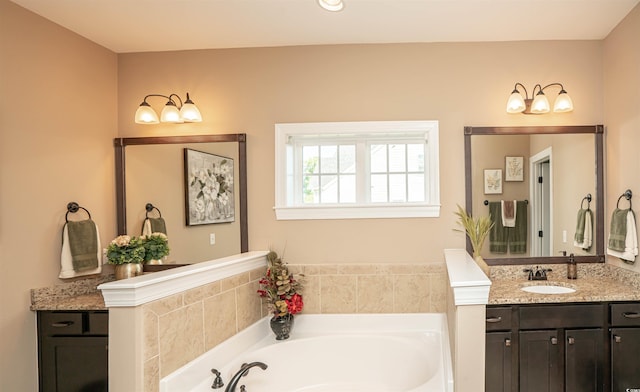 full bath with vanity and a garden tub