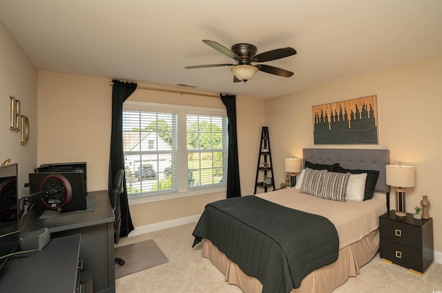 bedroom with baseboards, a ceiling fan, carpet, and visible vents