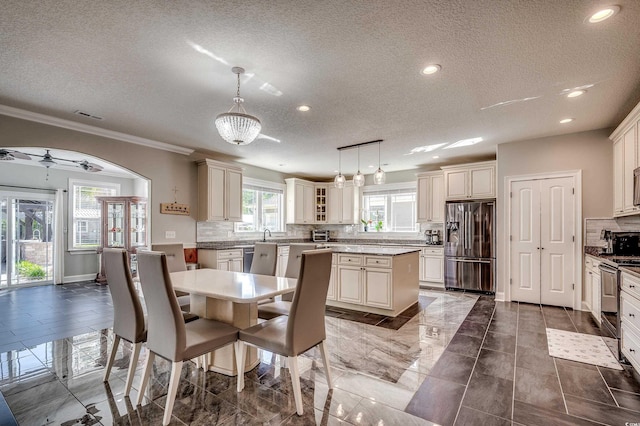 dining space featuring visible vents, recessed lighting, a textured ceiling, and ornamental molding